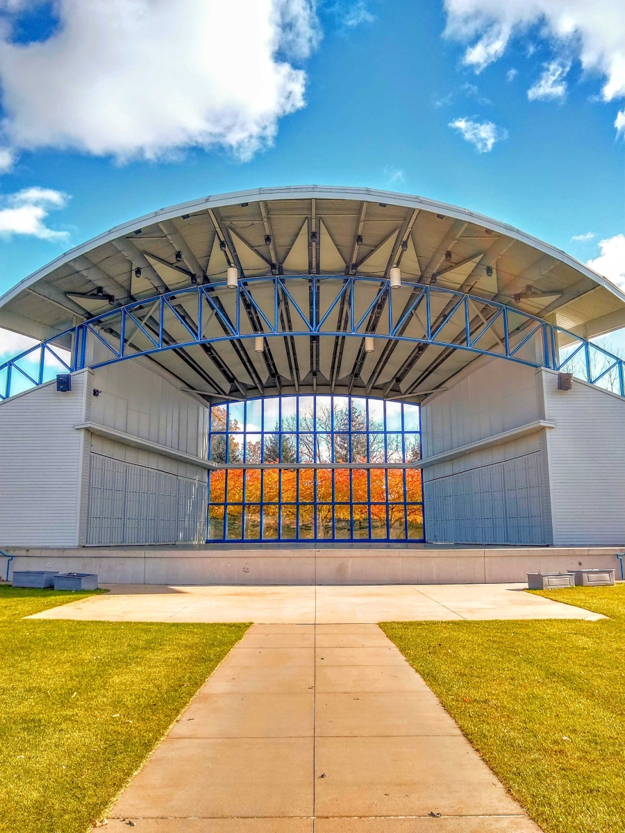 Looking through Hilde Performance Center's bandshell to find Fall Foliage by Cathy Milostan