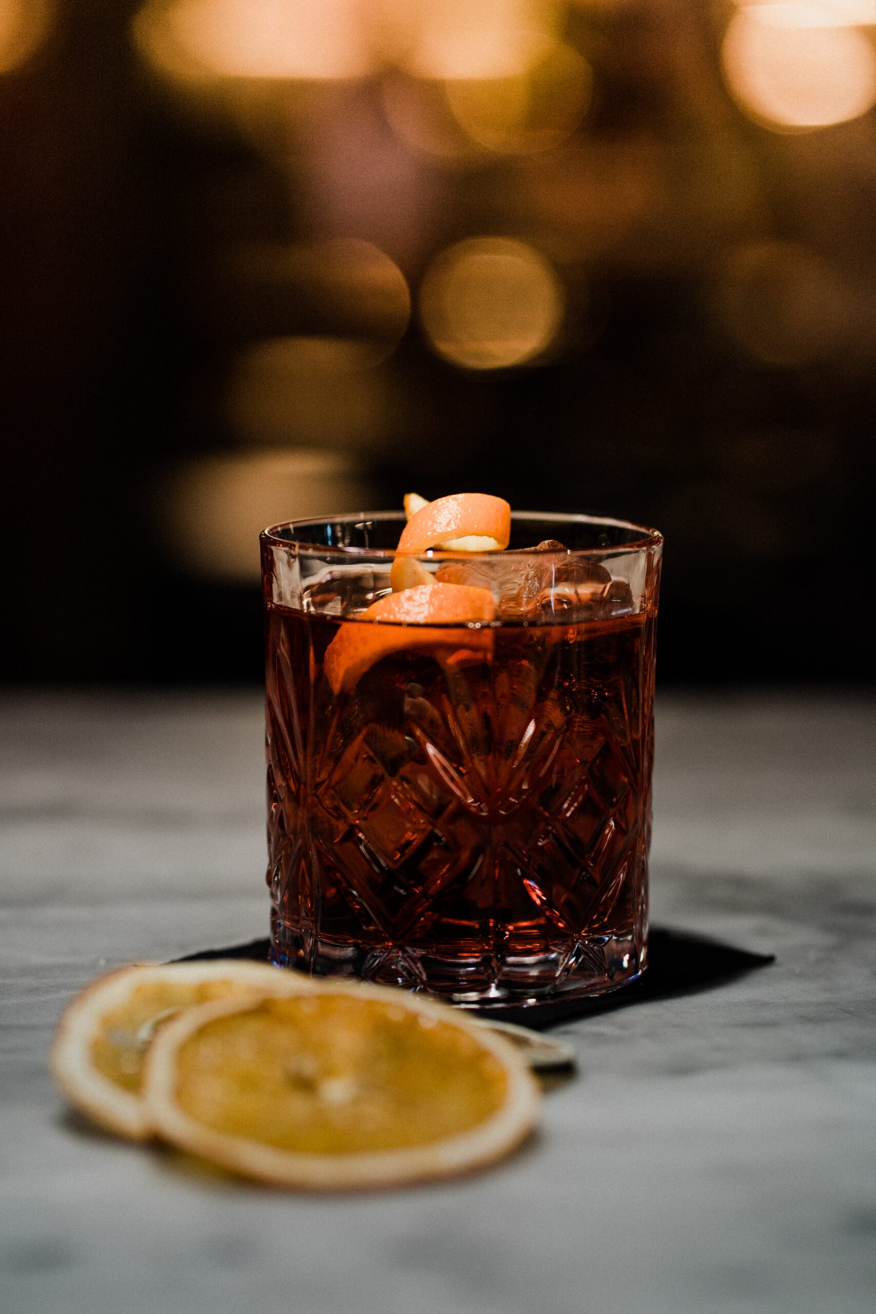 Winter Rum Old Fashioned garnished with an orange peel.