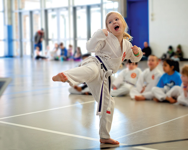 Bellatrix Shamblin performs a kick at Plymouth National Karate School