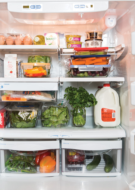 A fridge full of organized groceries.
