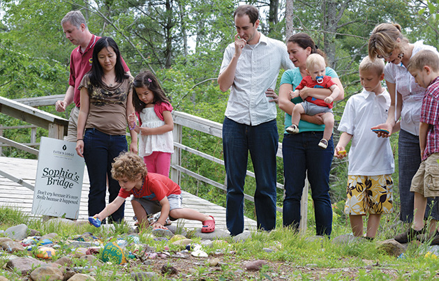 A family visits Sophia's Bridge of Hope at Faith's Lodge.