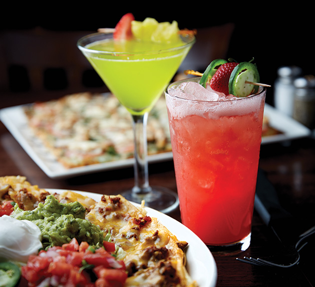 Two cocktails and a plate of nachos from the Sunshine Factory, voted Best Restaurant, Best Tavern and Best Patio Dining in the 2019 Best of Plymouth readers' survey.