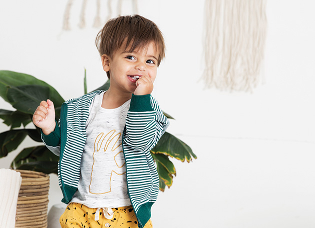A child models organic clothes from online boutique Lulie Kids.