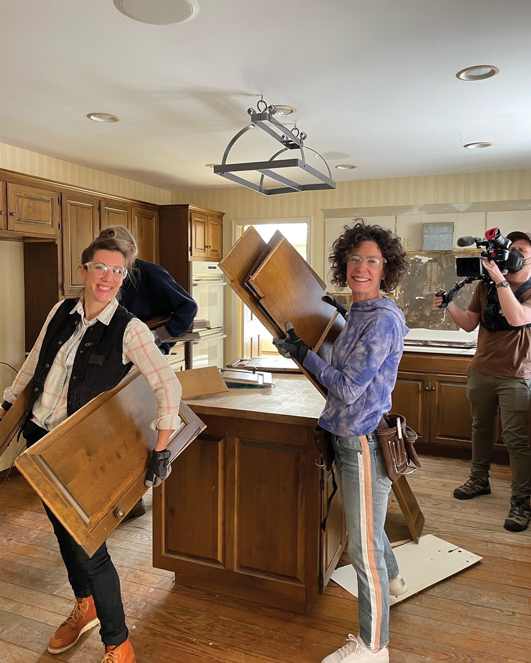 Kirsten Meehan and Lindsey Uselding filming an episode about the home of their colleague and his wife, Ron and Sonia Ungerman. The home had ice dams that caused water damage throughout the house. Photo: Ungerman,