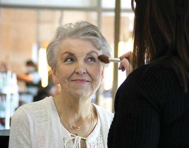 Plymouth resident and cancer patient Marilyn Stalheim receives VIP treatment from New Reflections staff at her surprise makeover party organized by Hello Gorgeous. 