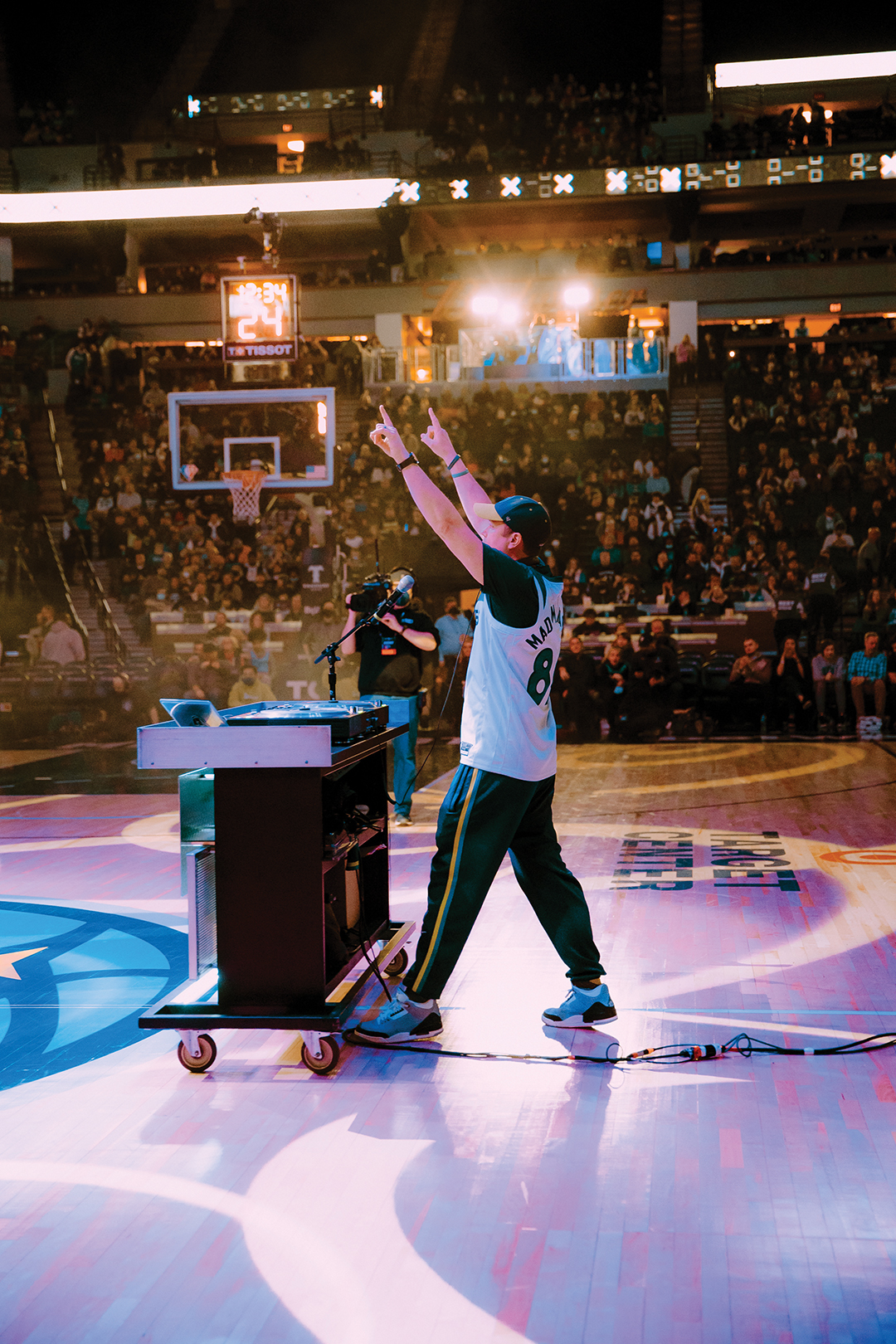 Timberwolves fans look on as DJ Mad Mardigan takes over the court for a halftime show.