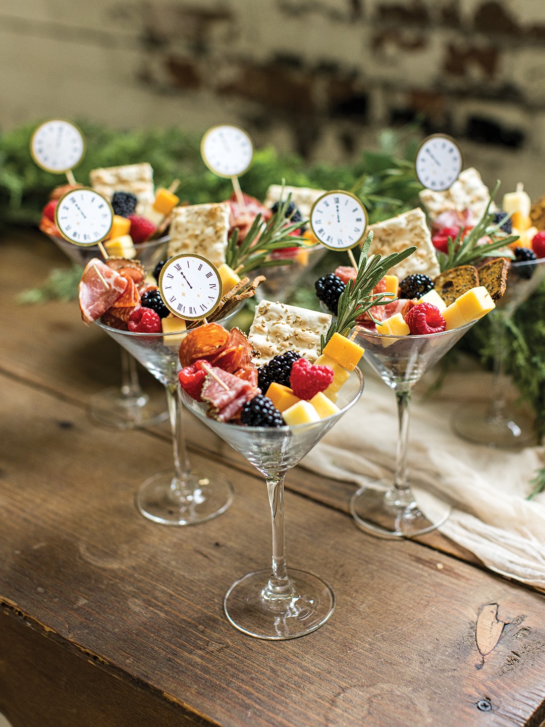 Easy-to-handle charcuterie cups using martini glasses.