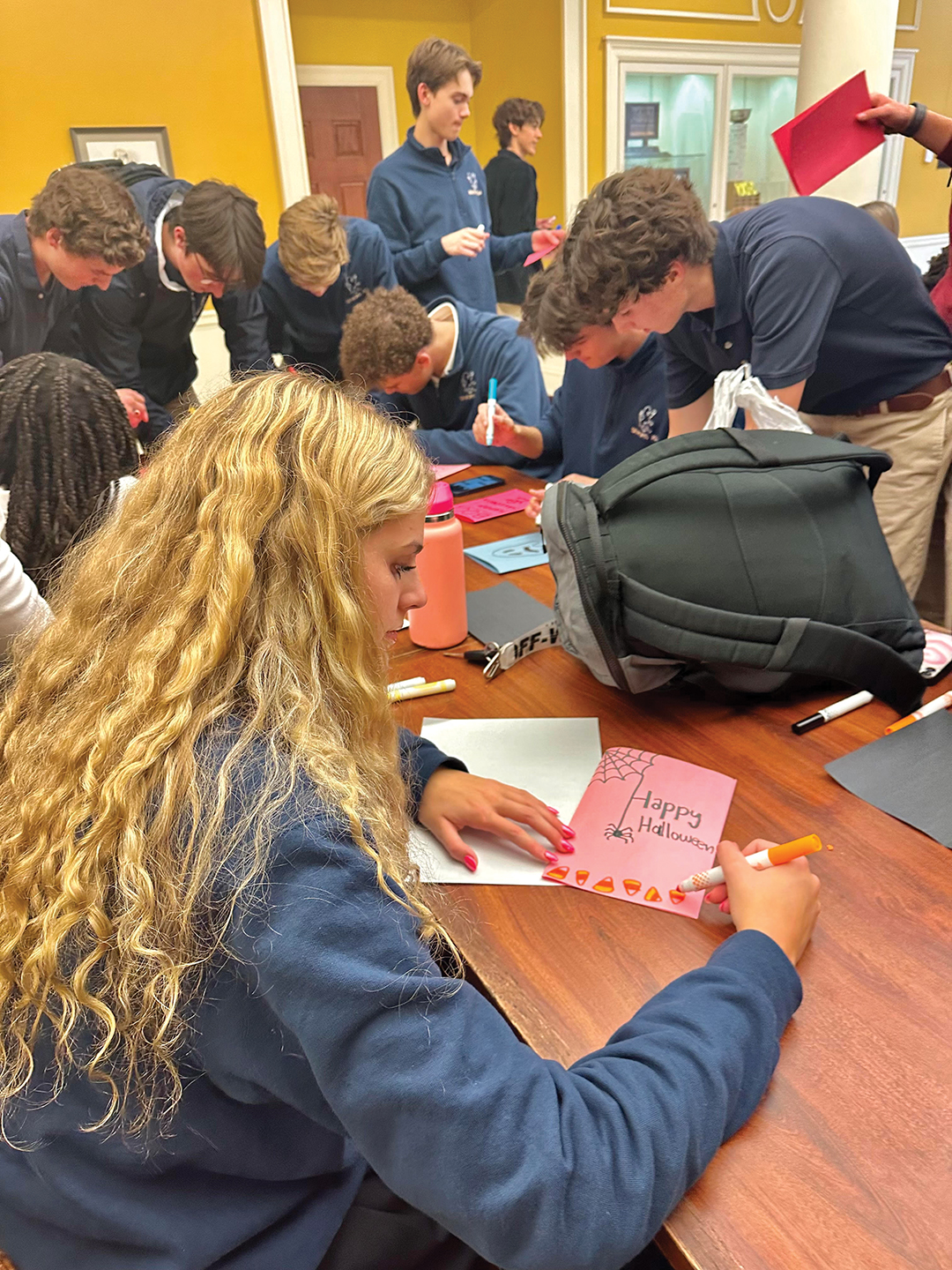 Members of Providence Academy’s Letters of Love club create seasonal Halloween and Thanksgiving cards.