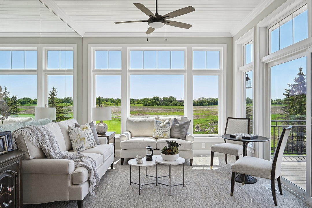 The model home at Marsh Pointe Preserve uses transom windows to full effect, adding extra oomph with a mirrored wall that duplicates the outdoors.