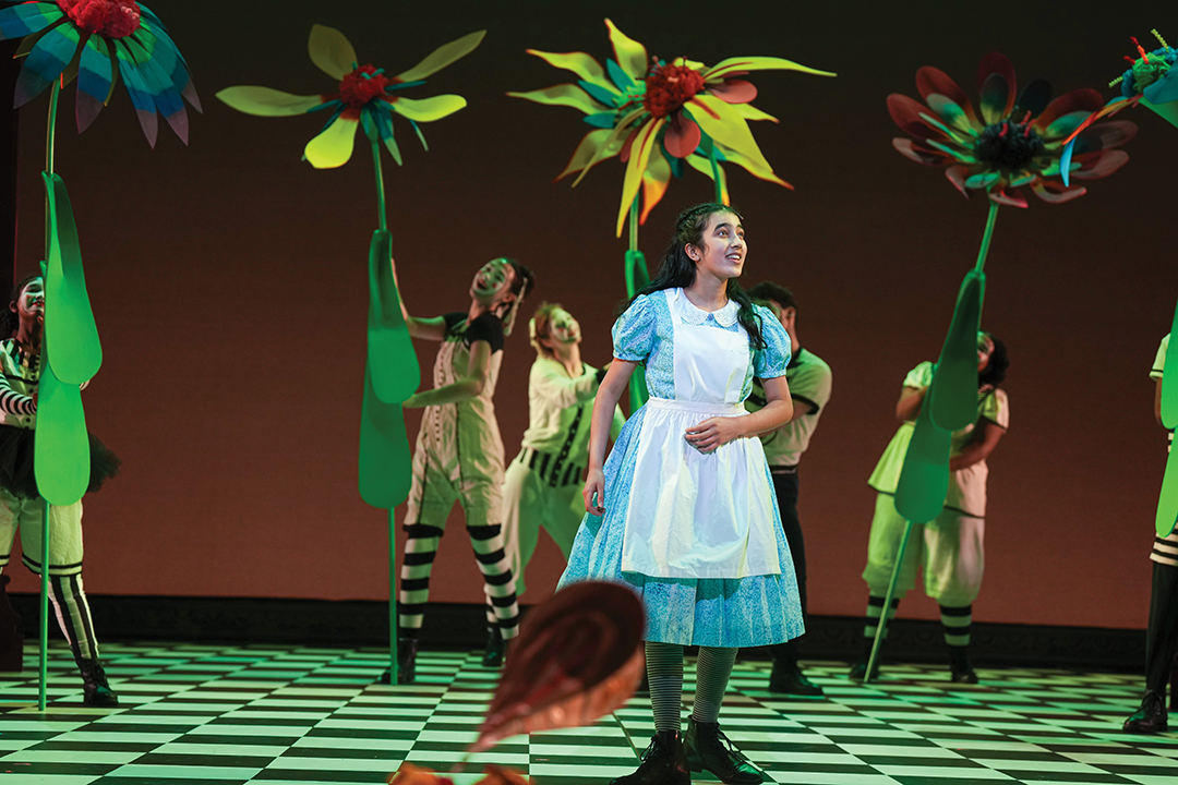 Actress Anja Arora performs the titular role in the Children’s Theatre Company’s production of Alice in Wonderland.