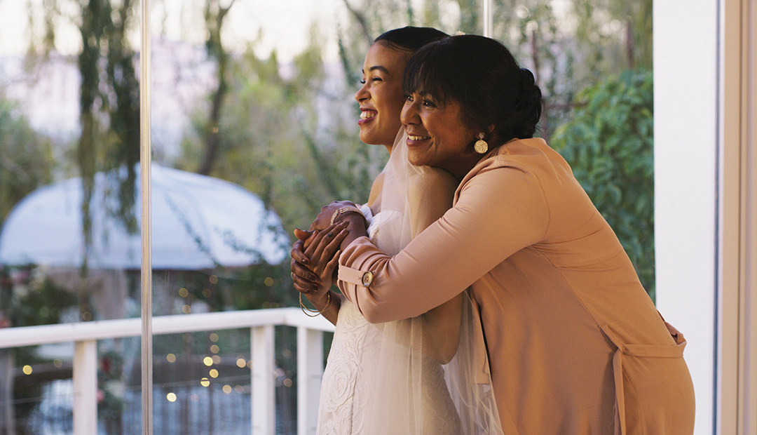 Cropped shot of a happy young bride bonding with her mother while she gets ready for her wedding