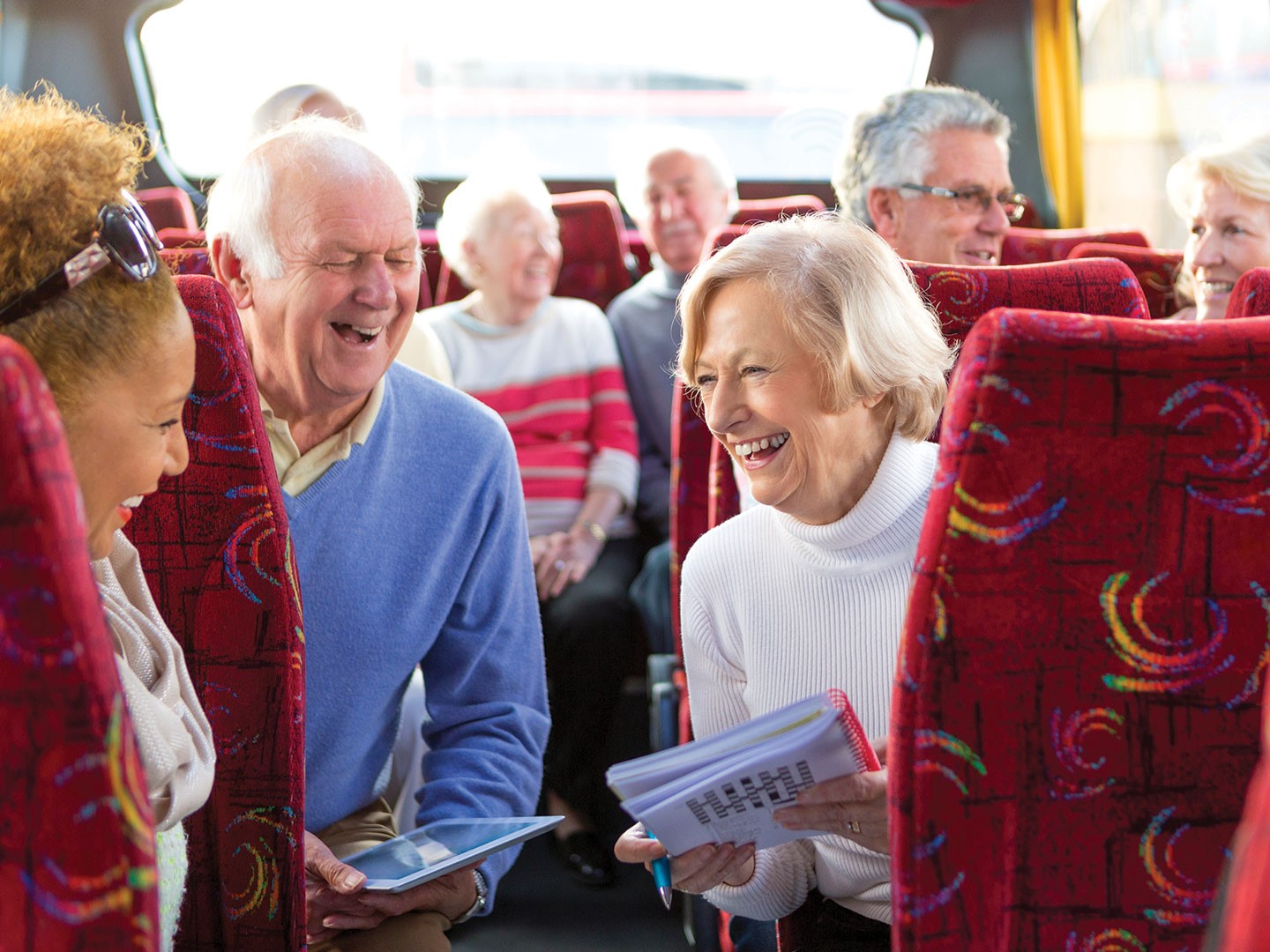Group of seniors on a charter bus.