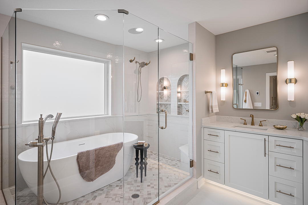 The freestanding soaking tub is one of the en suite bathroom’s most striking features.