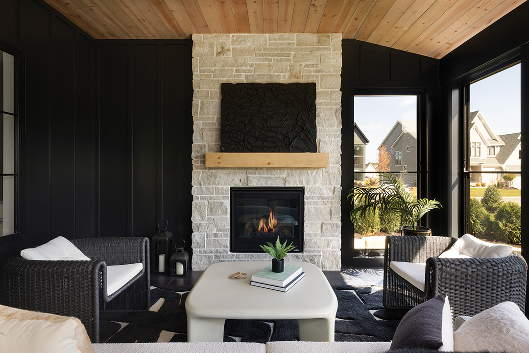 A lightly stained ceiling can offset the closeness of dark walls. Carbon 6 used Barnwood Whitewashed pine from Distress City Millwork for this sunroom painted in Sherwin-Williams Tricorn Black.