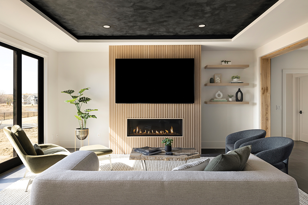 This 6-inch recessed ceiling is painted in Roman Clay’s Fade to Black. “It allows the space to be more defined and gives it some interest without totally taking over because it’s a higher ceiling,” Lindsey Swanson says.