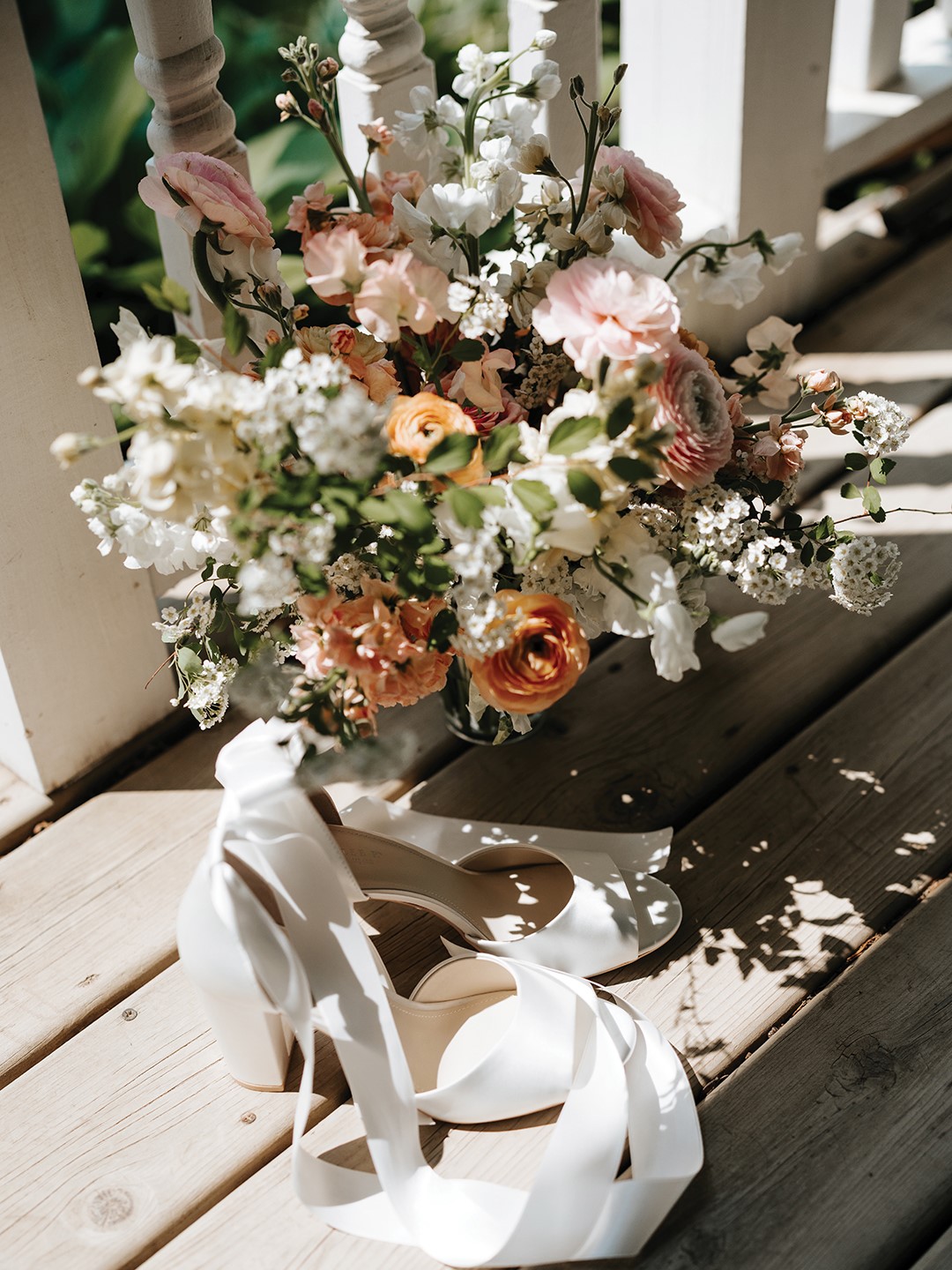 Annika Thalmann’s bridal bouquet from Malana Sophia Floral incorporated ranunculus, roses, spirea and sweet pea.