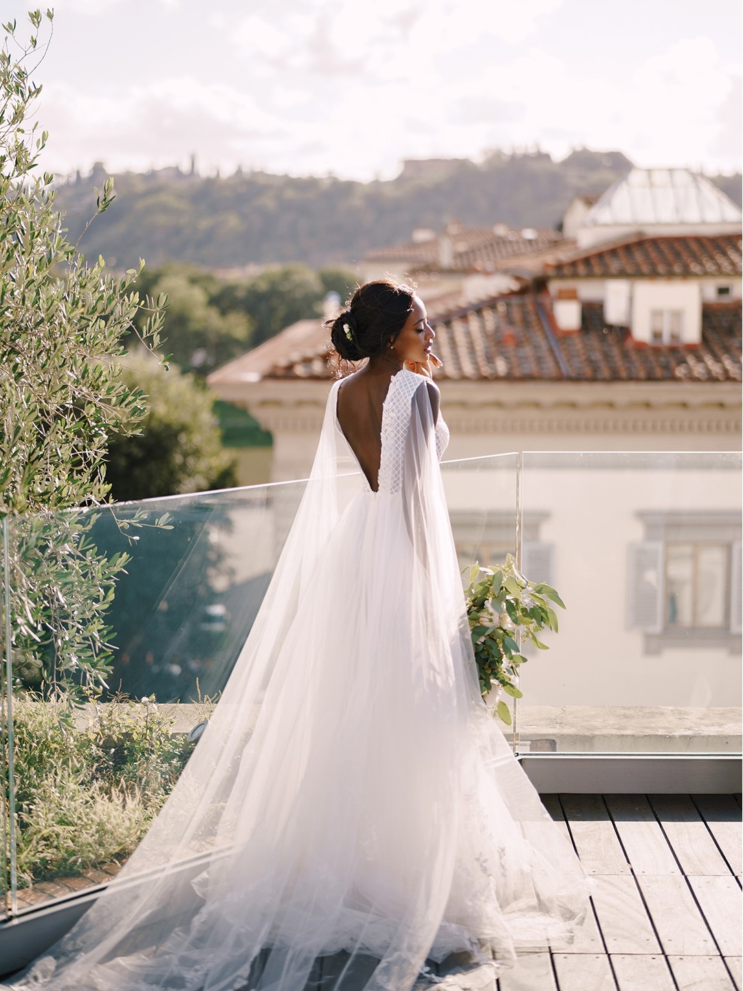 Woman in her wedding dress outdoors