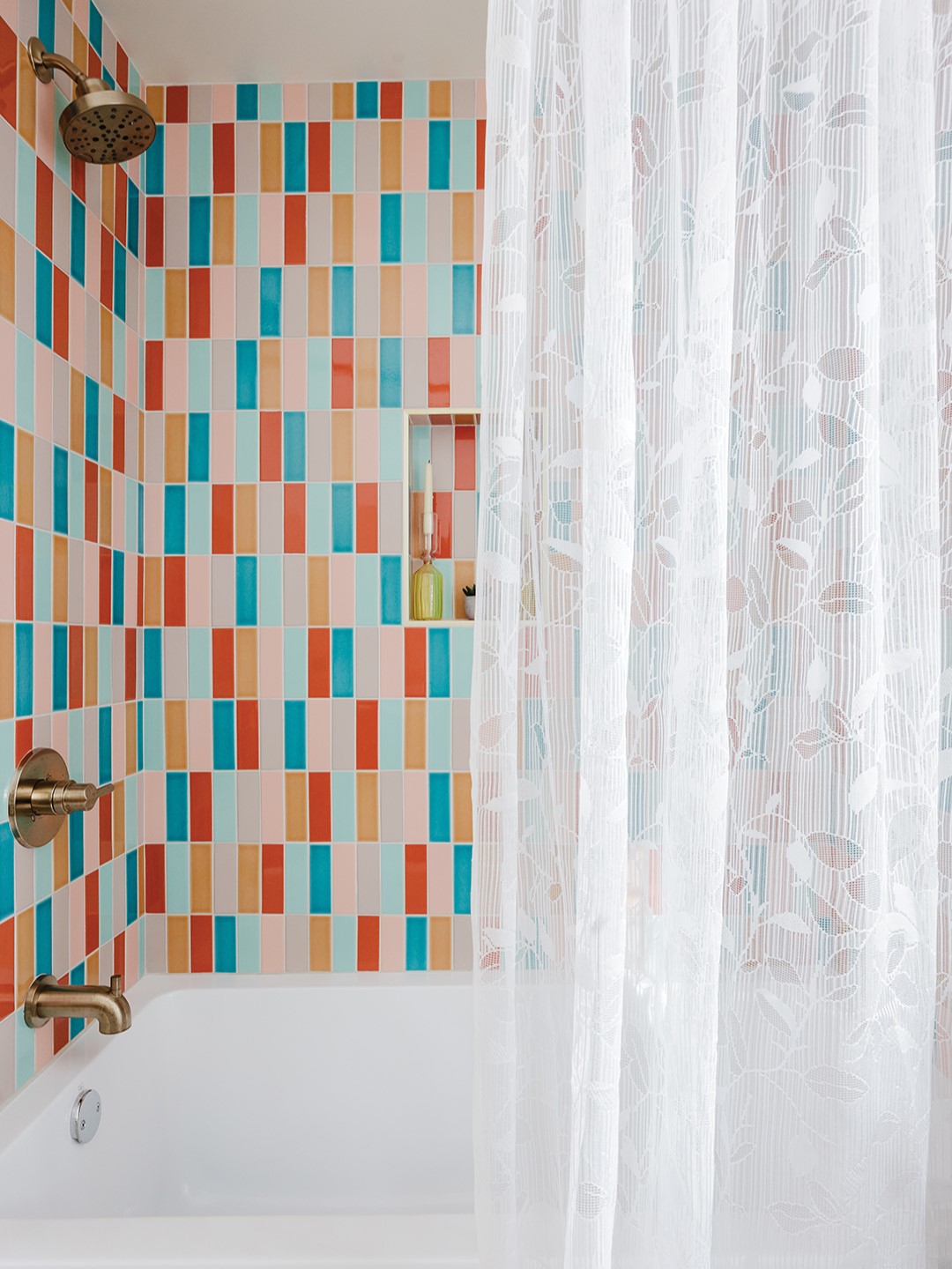 Taylor Morrill and Declan McCrory told Lidia Valdivia which colors they loved, and Valdivia ran with the selection, creating a tub surround that surprises and delights as soon as the curtain is pulled. Valdivia says the bathtub tiles are one of her favorite parts of the remodel. “At Moonstone, we love color,” she says. 