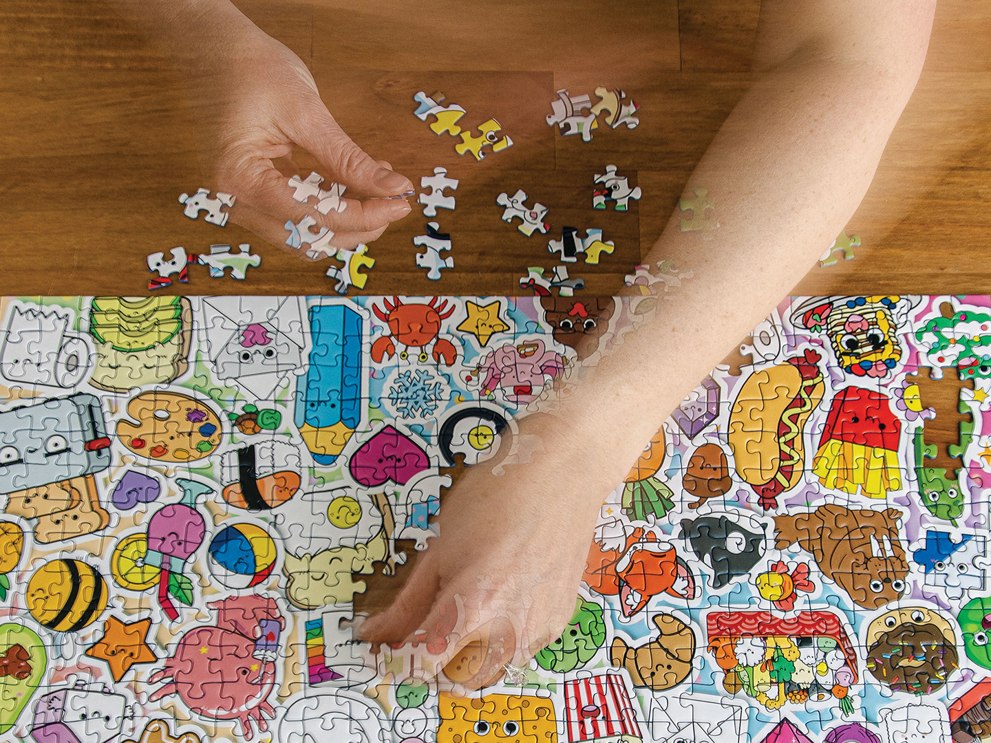 Heather Mueller works Cute Kawaii Chaos, a 500-piece puzzle by Ravensburger.