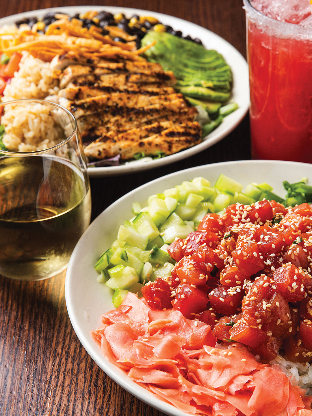 April Hanson says the TexMex Salad (left) and Poke Bowl (right) are personal favorites of her and her husband, Brian Hanson. These dishes are also top picks among Sunshine Factory Bar & Grill regulars.