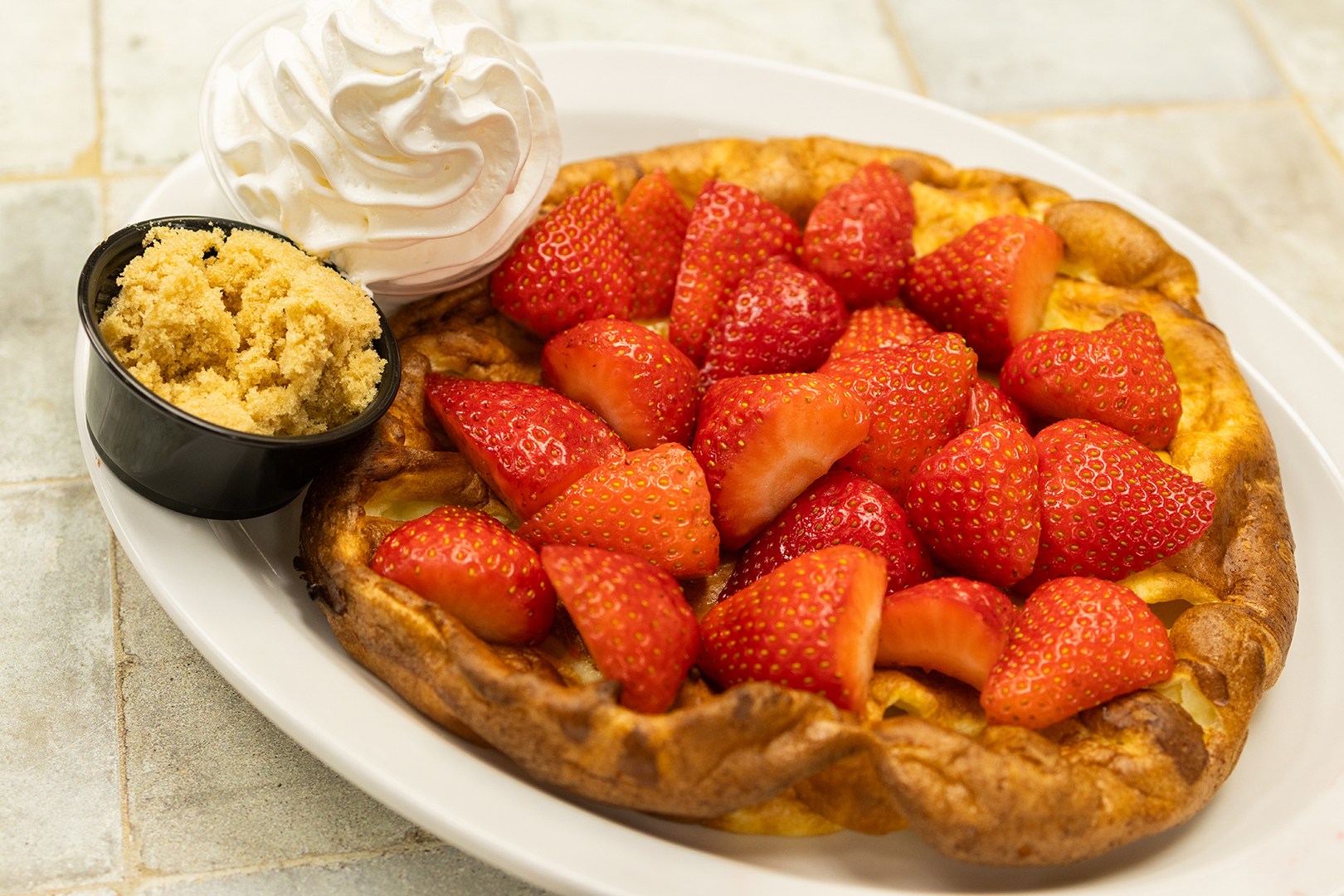 The Strawwwwwberries Pannekoeken includes a hefty serving of strawberries on top of a traditional pannekoeken.