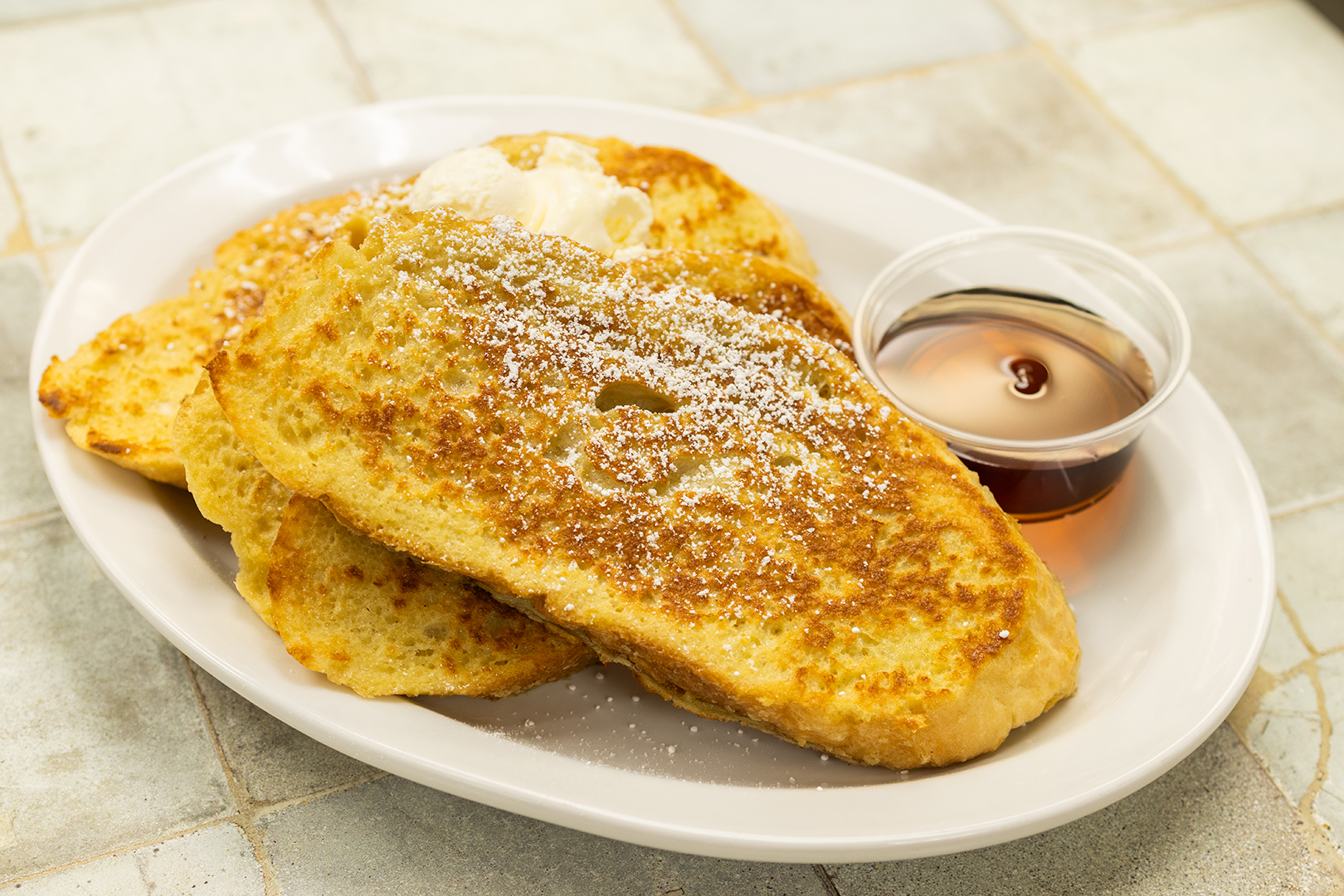 Pannekoeken Huis breakfast sides including slices of French Toast is available a la carte.