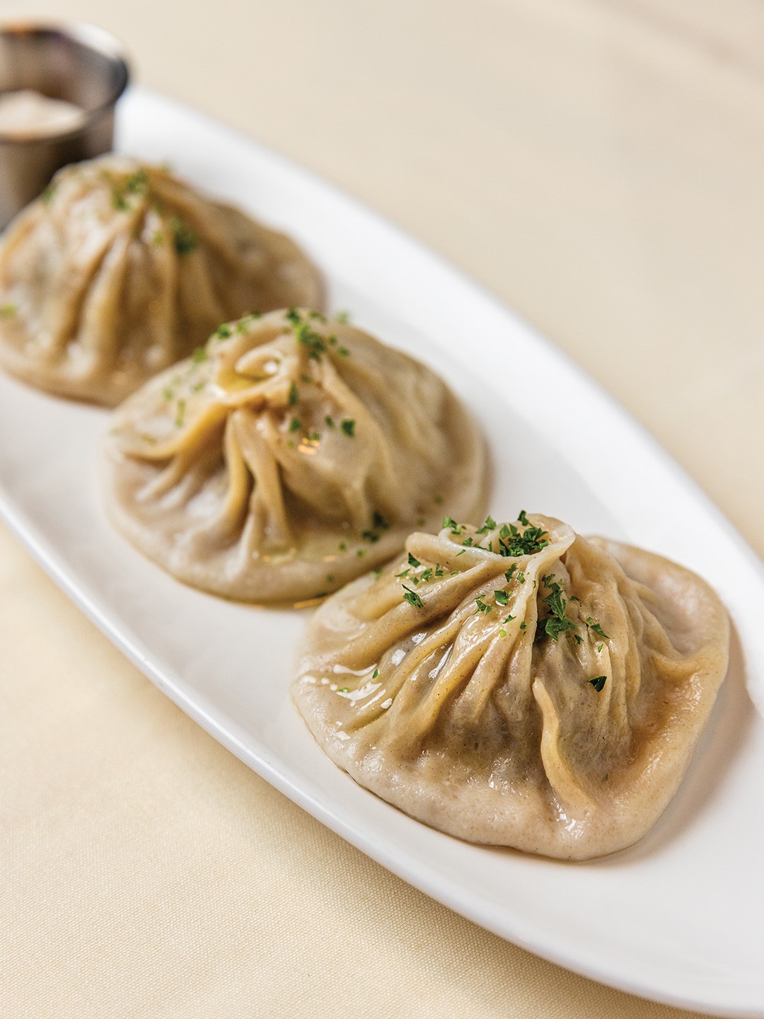 Mantu are large, steamed buns filled with beef and onions. 